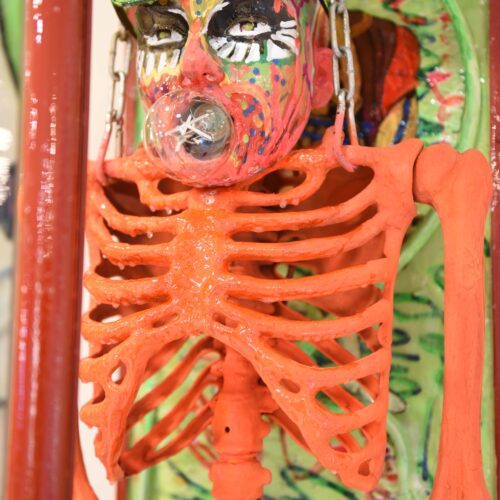 Side close-up view of Humberto Poidomani's Halloween sculpture showcasing intricate details and textures.